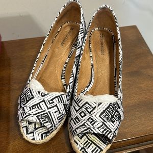 Black and white slip ons